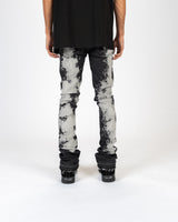 "SCARRED BY" FLARE STACK DENIM